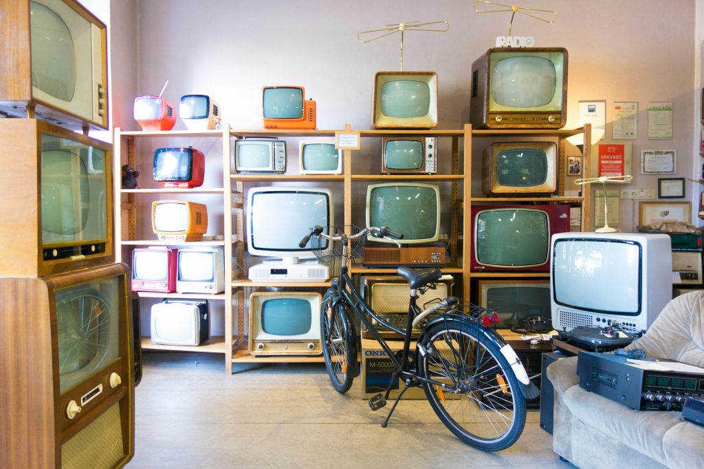 Old TVs awaiting recycling to contribute to reducing electronic waste.